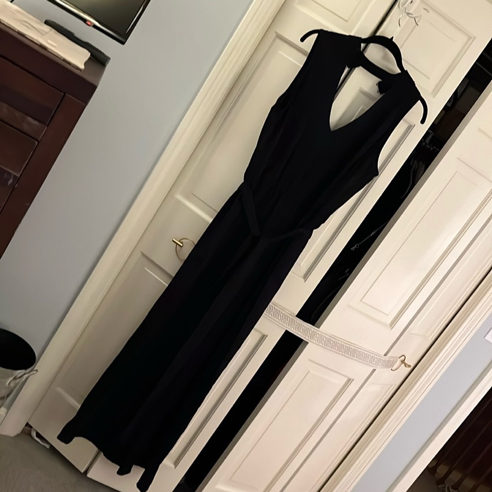 Sleeveless jumpsuit elastic waist button neck w zipper back,Wide legs.